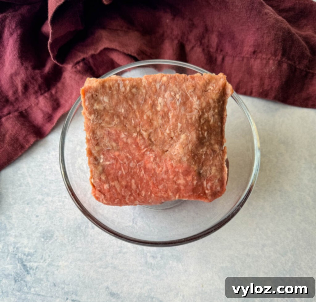 Raw ground beef in a glass bowl