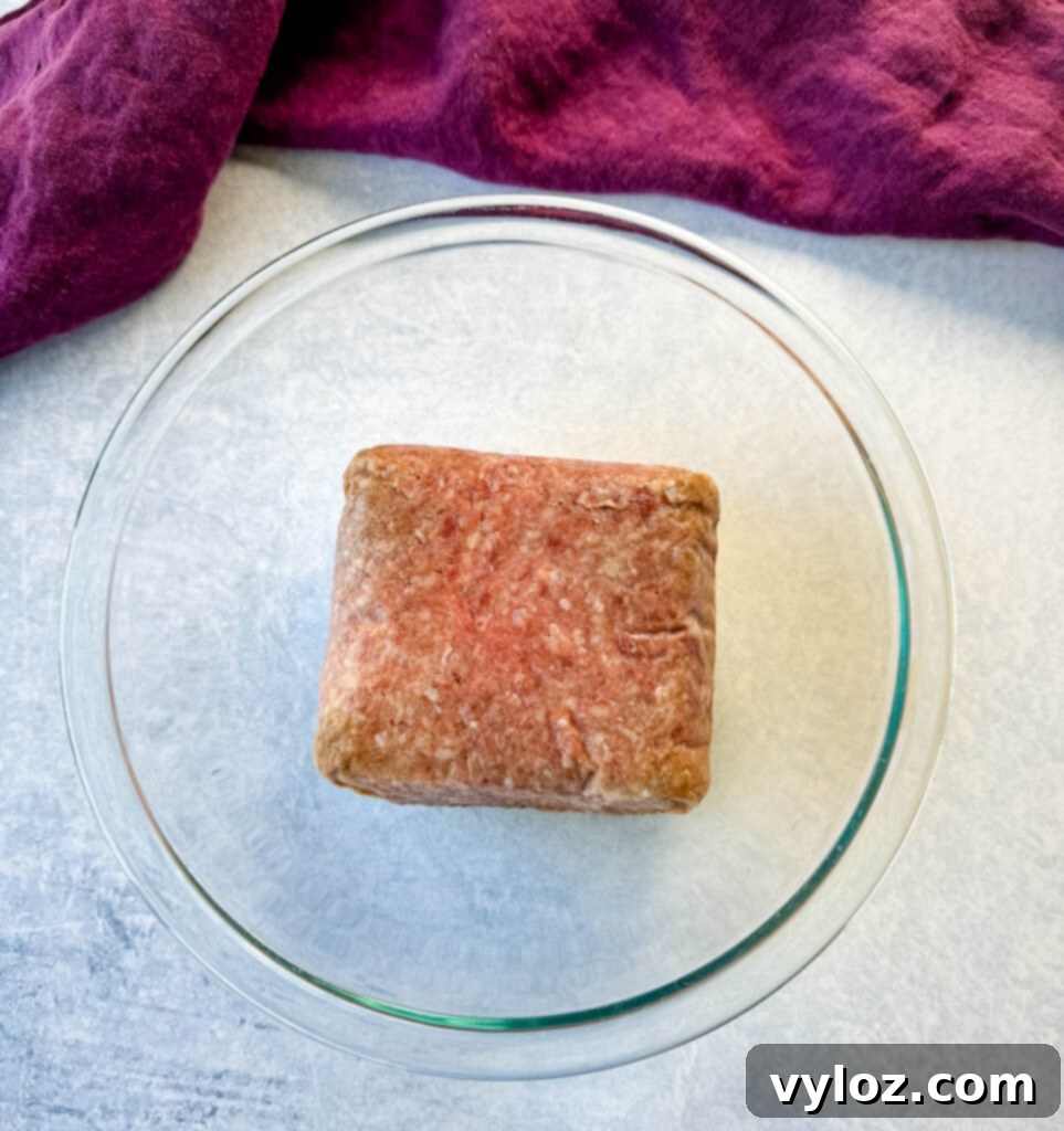 raw ground beef in a glass bowl