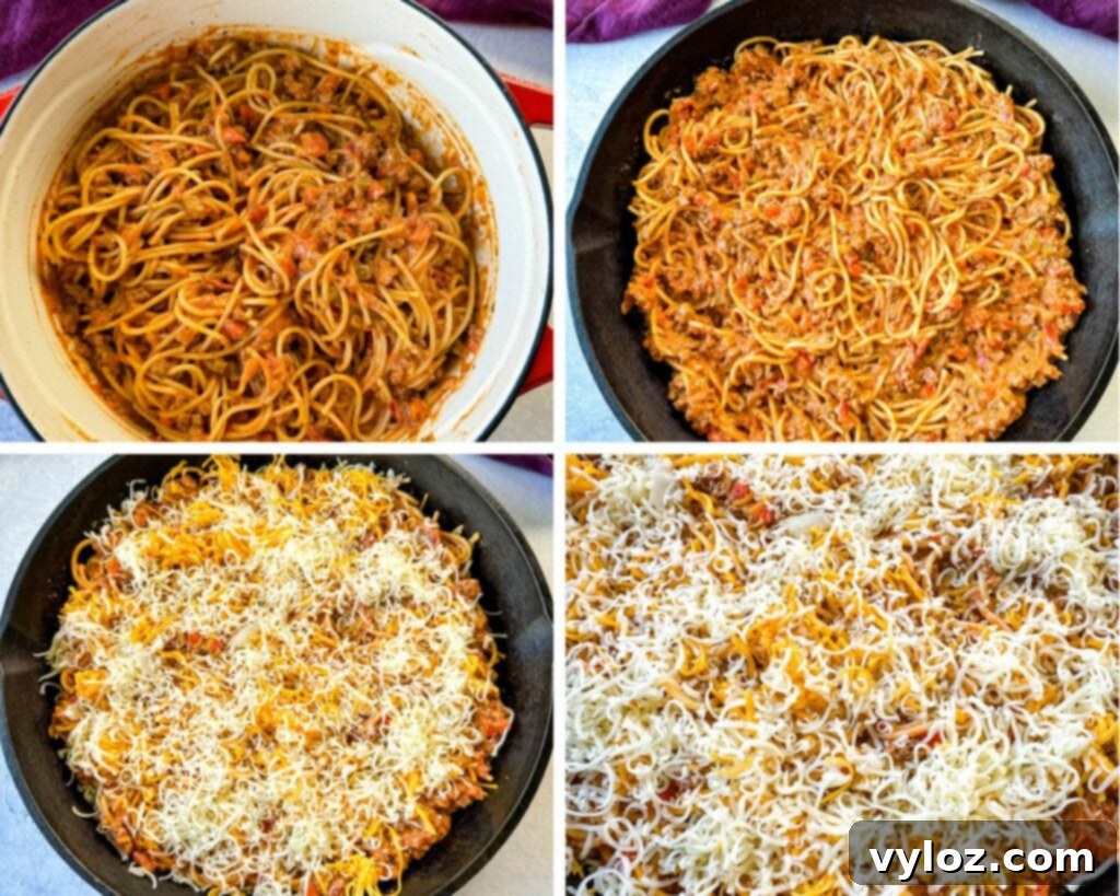 million dollar spaghetti in a pan with grated cheese