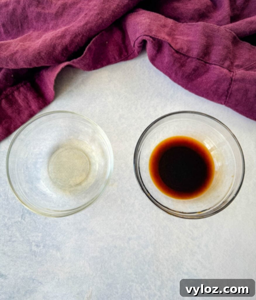 soy sauce and rice wine vinegar in separate glass bowls