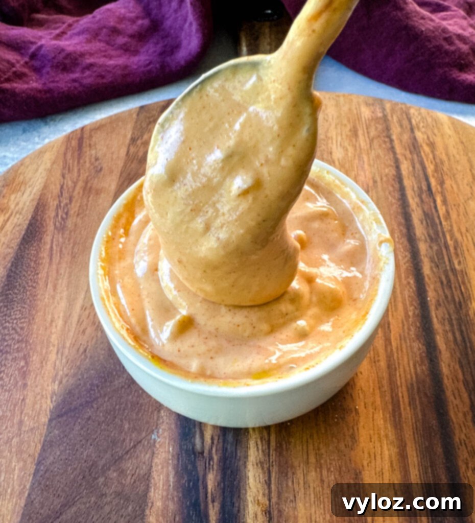 homemade burger sauce in a white bowl with a spoon