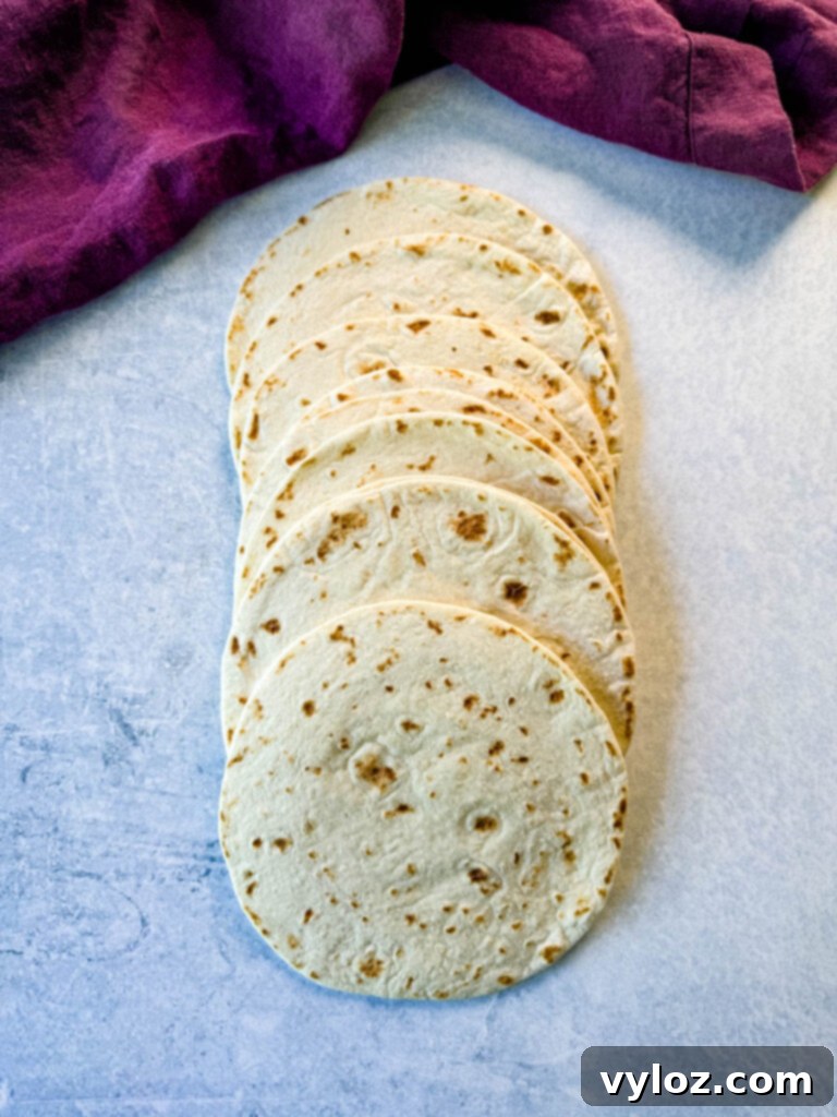 8 flour tortillas on a flat surface