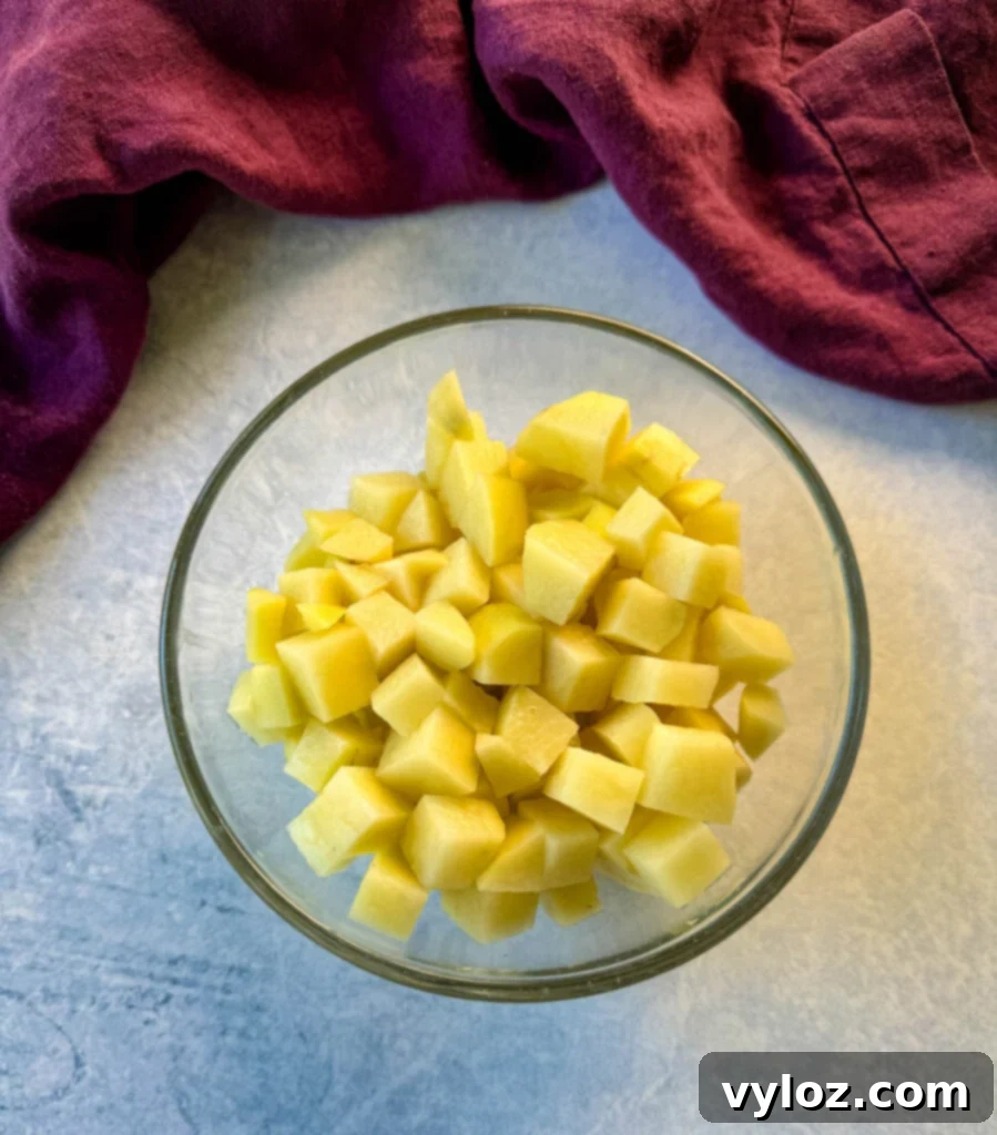 raw, diced potatoes in a glass bowl