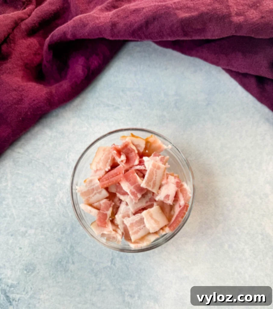 Smoky Slow Cooker Bacon Baked Beans 4 uncooked diced bacon in a glass bowl