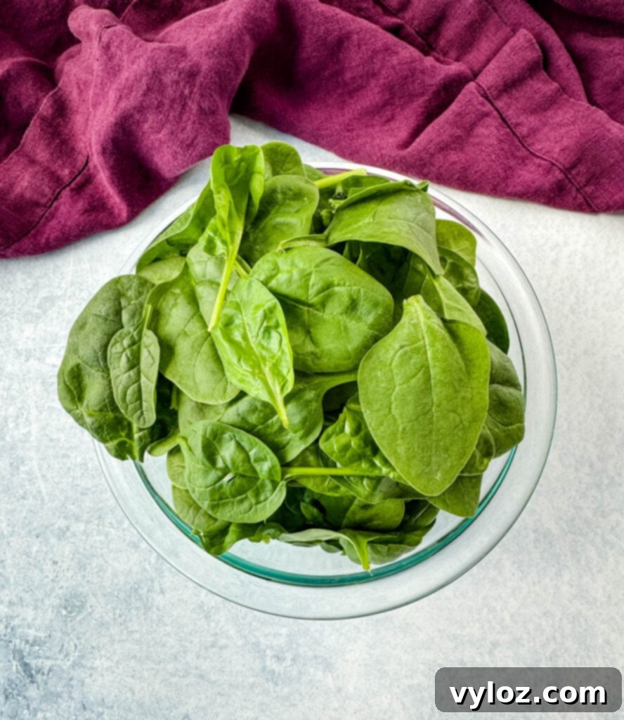 fresh spinach in a glass bowl