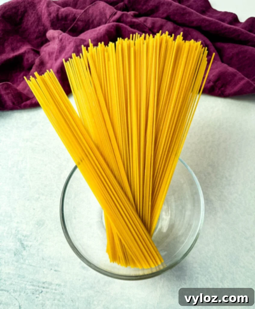 dry spaghetti pasta in a glass bowl