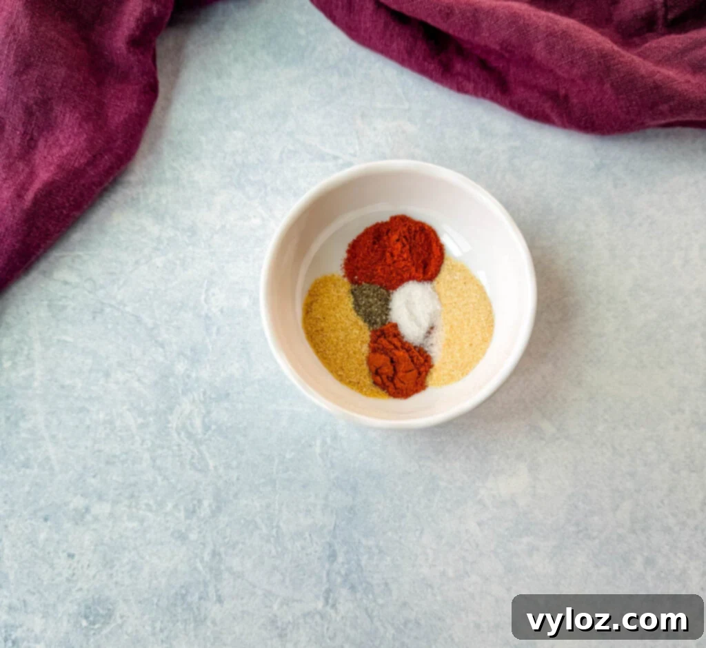 Sweet Heat Chicken Tenders 4 smoked paprika, cayenne pepper, garlic powder, salt and pepper in a small white bowls