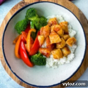 Sweet Heat Honey Chicken Bowls 11 A beautifully arranged hot honey chicken, rice, broccoli, and bell pepper vegetable bowl.