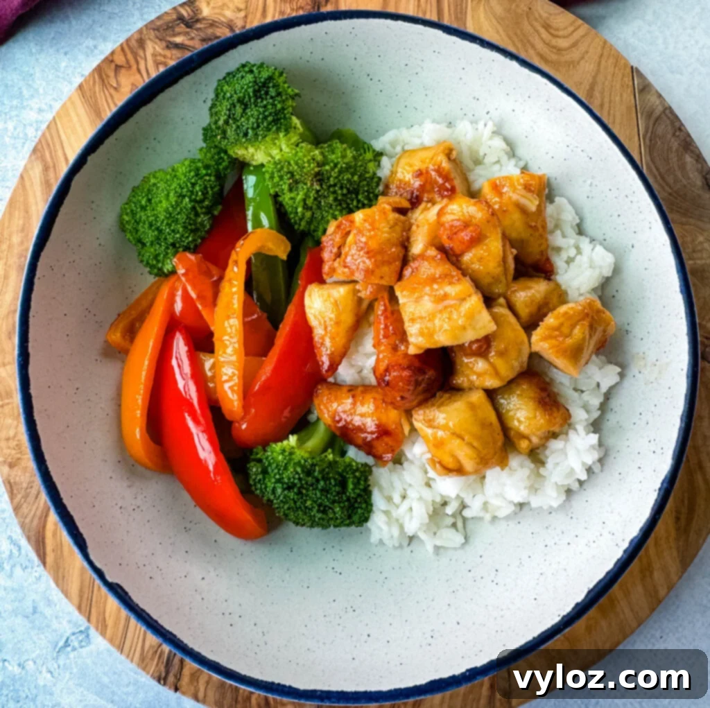 Sweet Heat Honey Chicken Bowls 10 A hot honey chicken and rice bowl with perfectly breaded chicken, rice, broccoli, and bell peppers.
