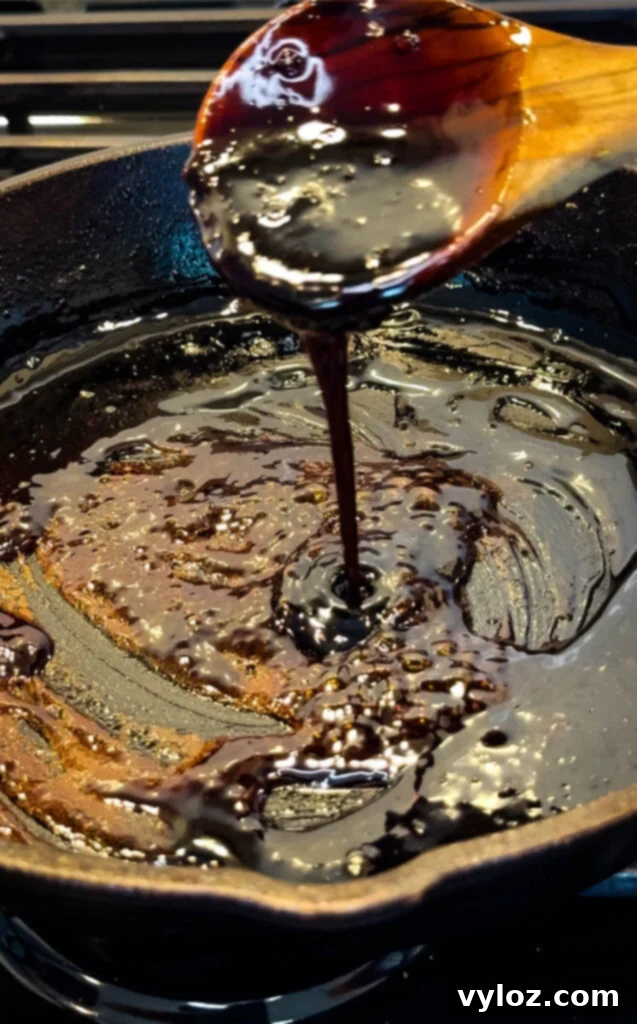 Ramen Noodle Beef and Broccoli Stir Fry 9 stir fry sauce in a wooden spoon an cast iron skillet