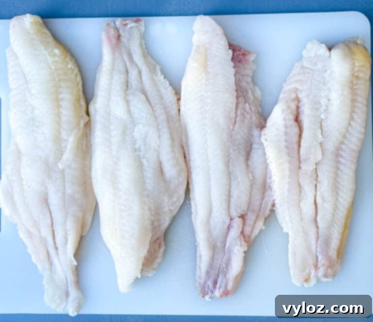 air fryer 3 ingredient fried catfish on a white plate