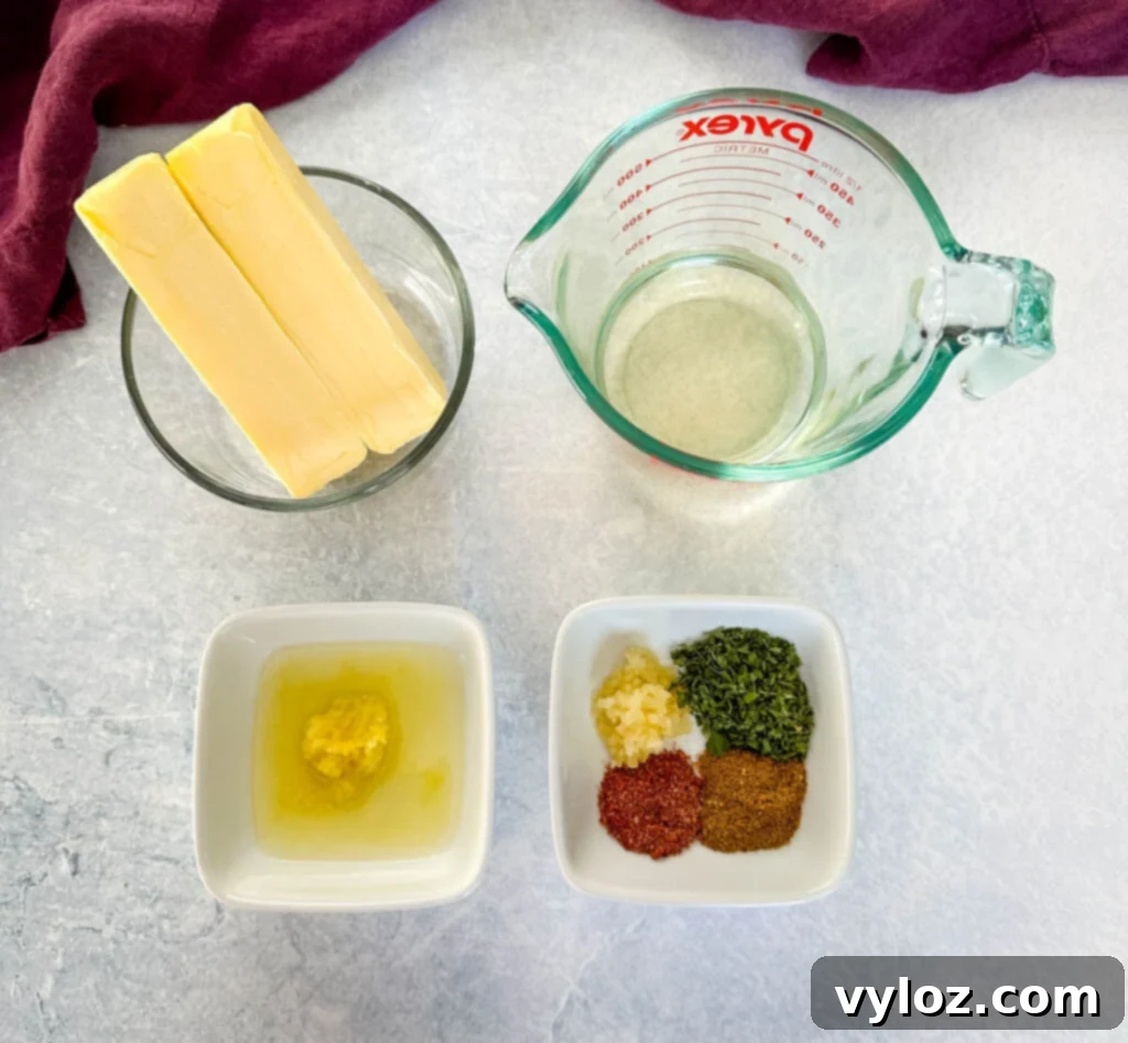 Garlic Butter Seafood Boil Bag 6 Sticks of butter, white wine, garlic, and various spices in separate bowls, ready for making the garlic butter sauce.