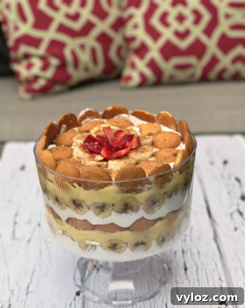 A generous serving of Southern Banana Pudding Trifle on a white plate, showcasing its delightful layers and creamy texture, ready to be enjoyed