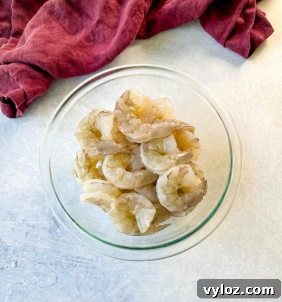 raw peeled shrimp in a glass bowl