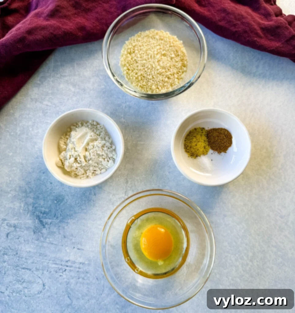 Golden Fried Fish Sandwich 3 breadcrumbs, flour, spices, and egg in separate bowls