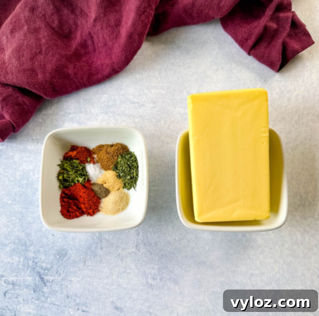 Cajun Crawfish Feast 11 A stick of butter and Cajun spices in separate white bowls, ready for a crawfish boil