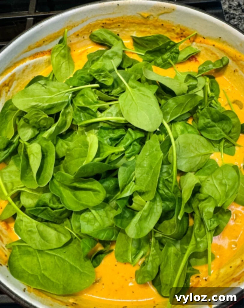 marry me Tuscan chicken soup with spinach in a Dutch oven