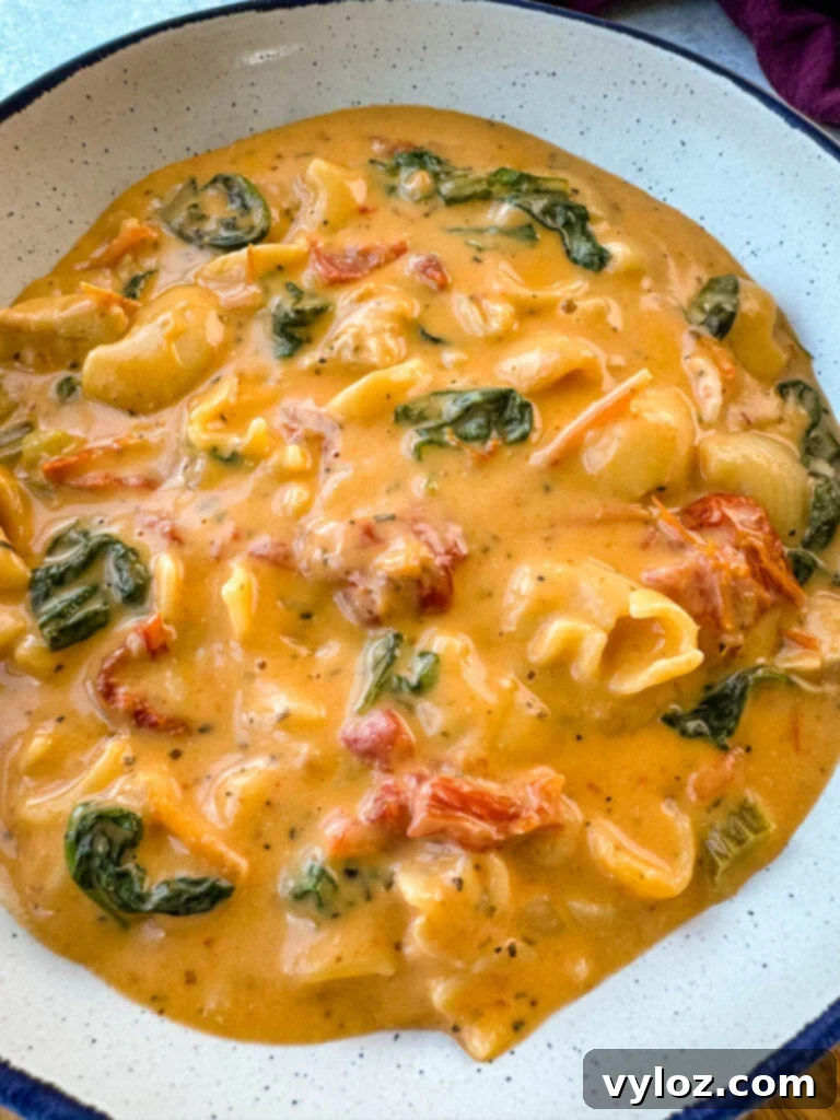 marry me Tuscan chicken soup in a white bowl