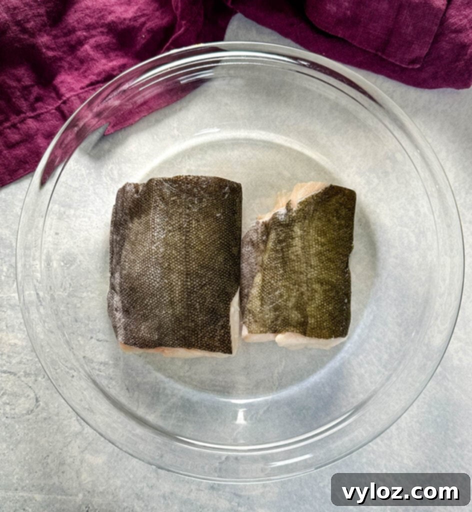 Mastering Nobu's Miso Black Cod 4 raw black cod fillets in a glass bowl