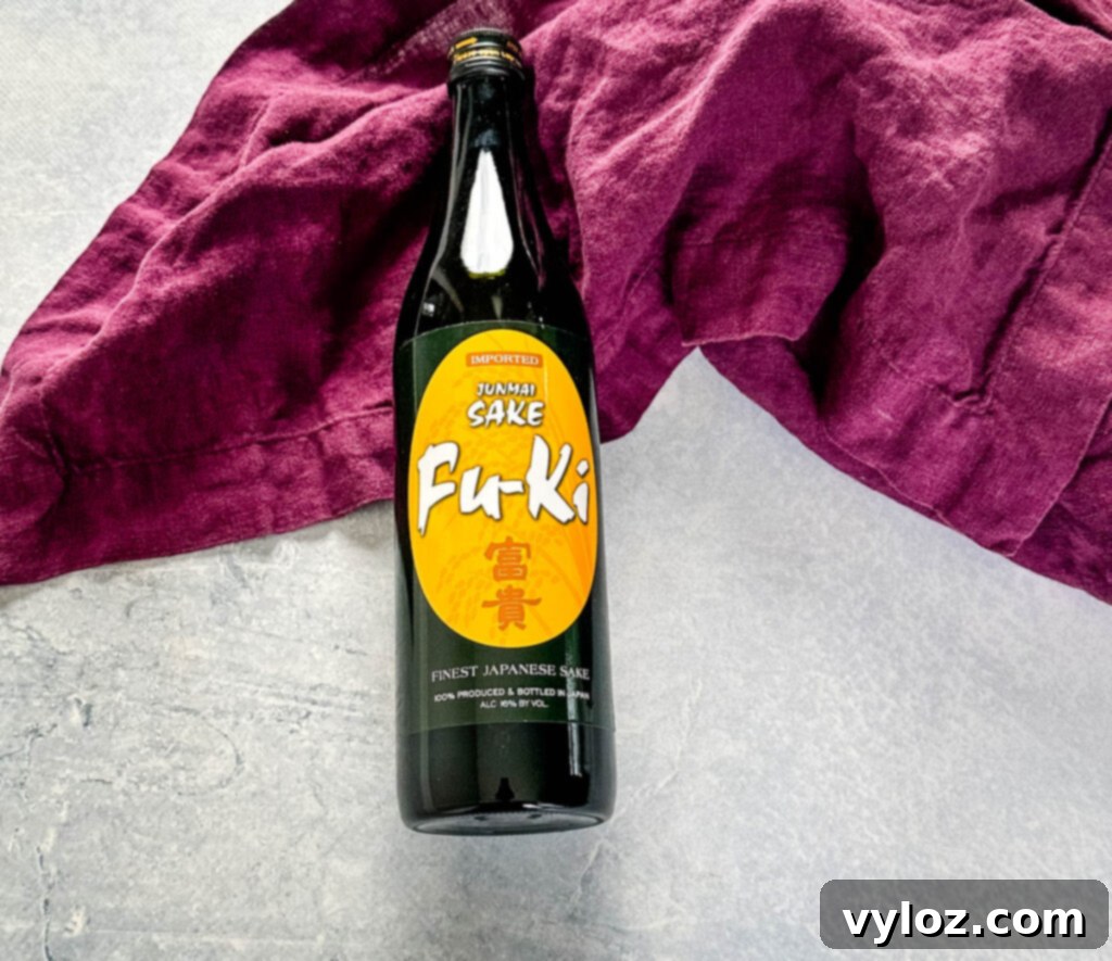 Mastering Nobu's Miso Black Cod 6 Japanese sake on a flat surface