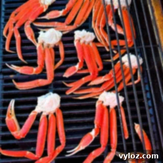 Grilled snow crab legs with butter and lemon on a platter