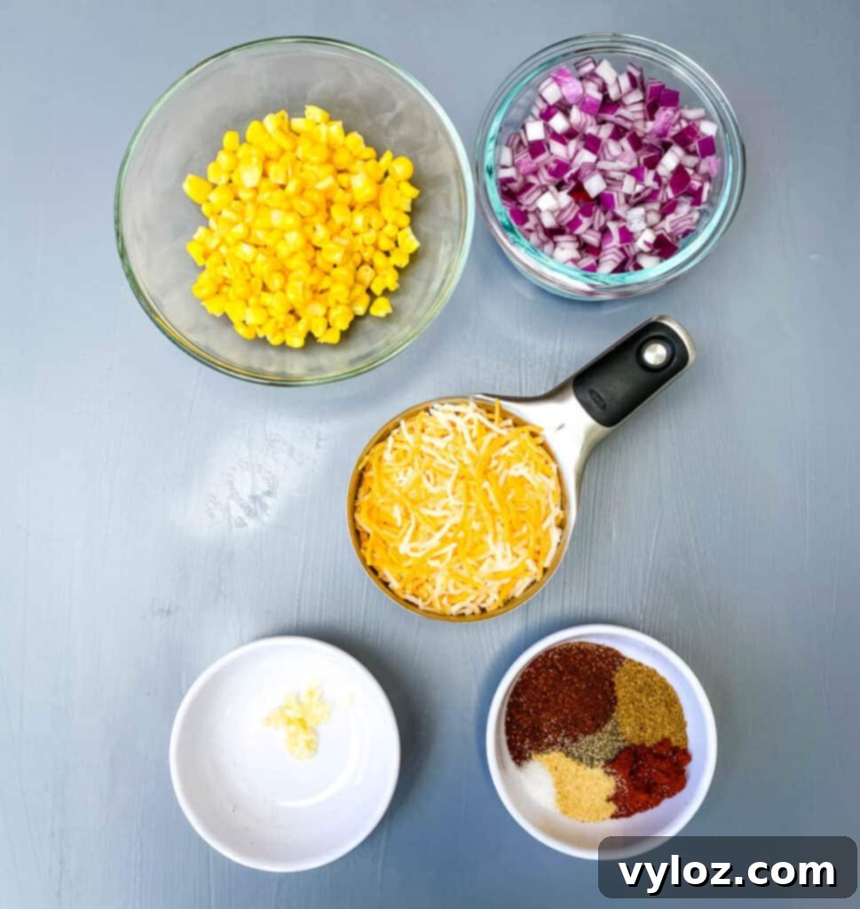 homemade taco seasoning, garlic, shredded Mexican cheese, chopped onions and frozen corn in separate bowls
