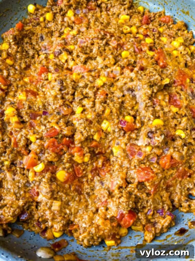 cook taco ground beef meat in a skillet