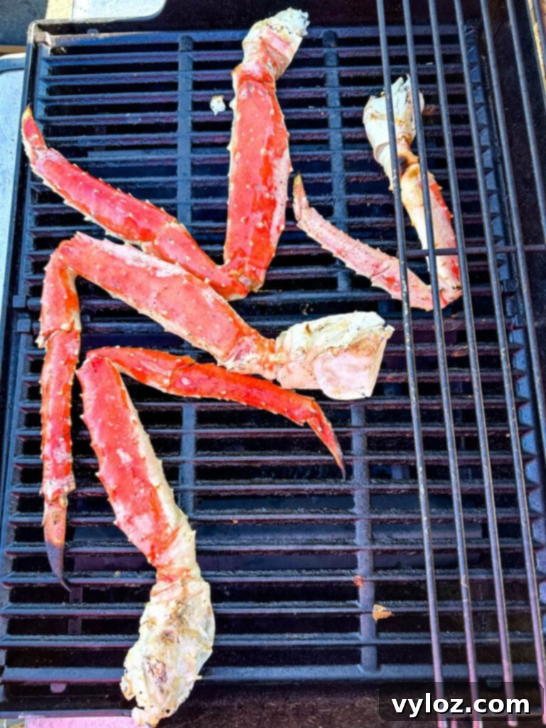 Grilled king crab legs on a grill with a slight char