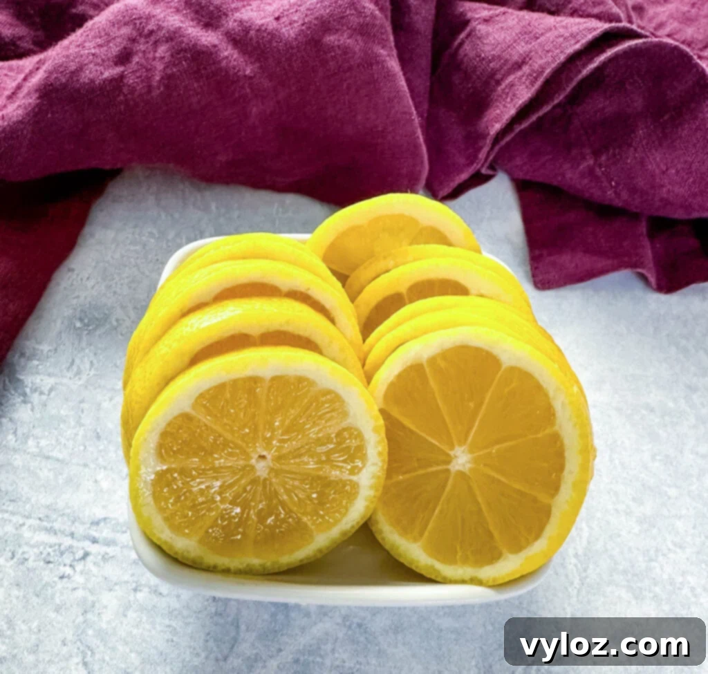 Fresh lemons sliced into perfect rounds, ready to be used as a garnish or for flavoring.