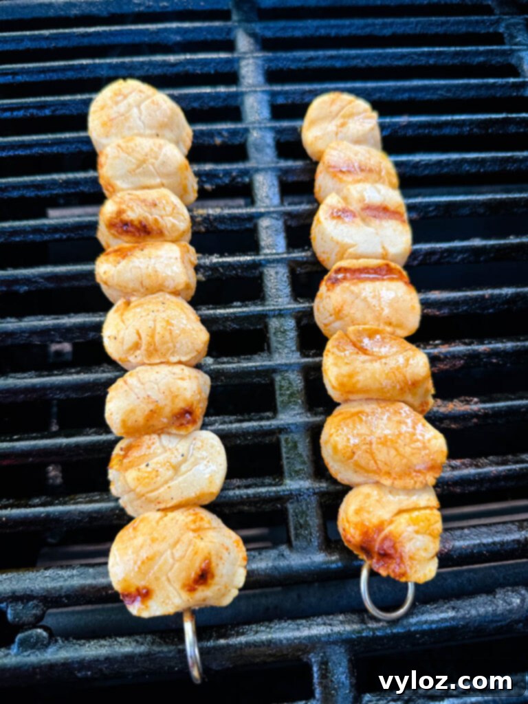 Chargrilled Citrus Scallops 8 scallops on a grill