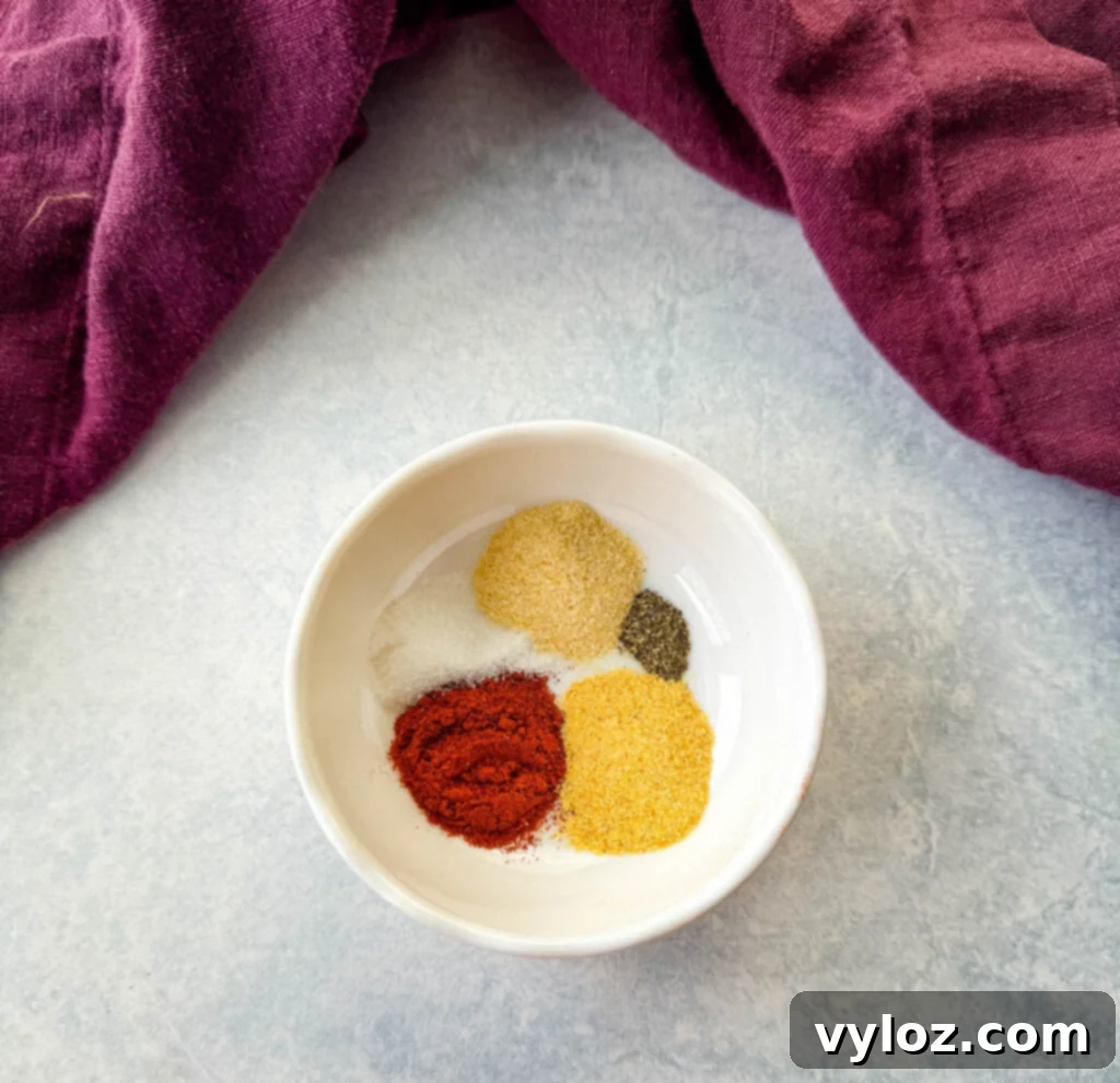 paprika, garlic powder, onion powder, salt, and pepper in a white bowl