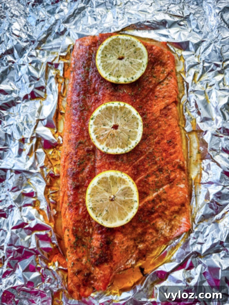 grilled salmon in foil with fresh lemons