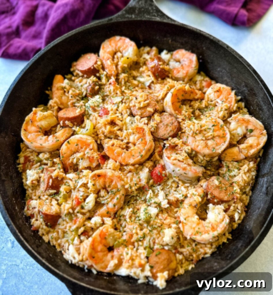 Creole shrimp jambalaya with crab in a cast iron skillet