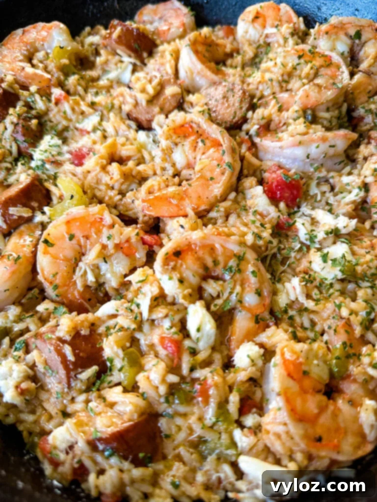 Creole shrimp jambalaya with crab in a cast iron skillet