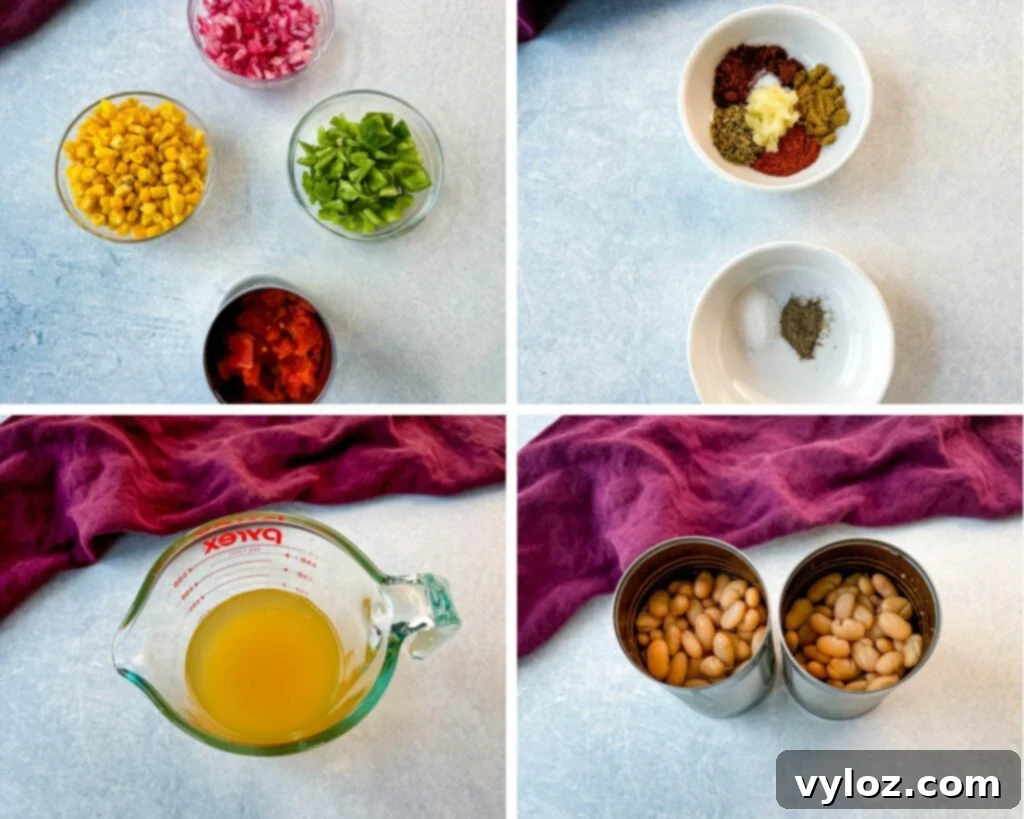 A vibrant collection of white chicken chili ingredients laid out: diced onions, sweet corn, colorful bell peppers, diced tomatoes with chilies, a selection of aromatic spices, rich chicken broth, and canned white beans in separate bowls, ready for preparation.