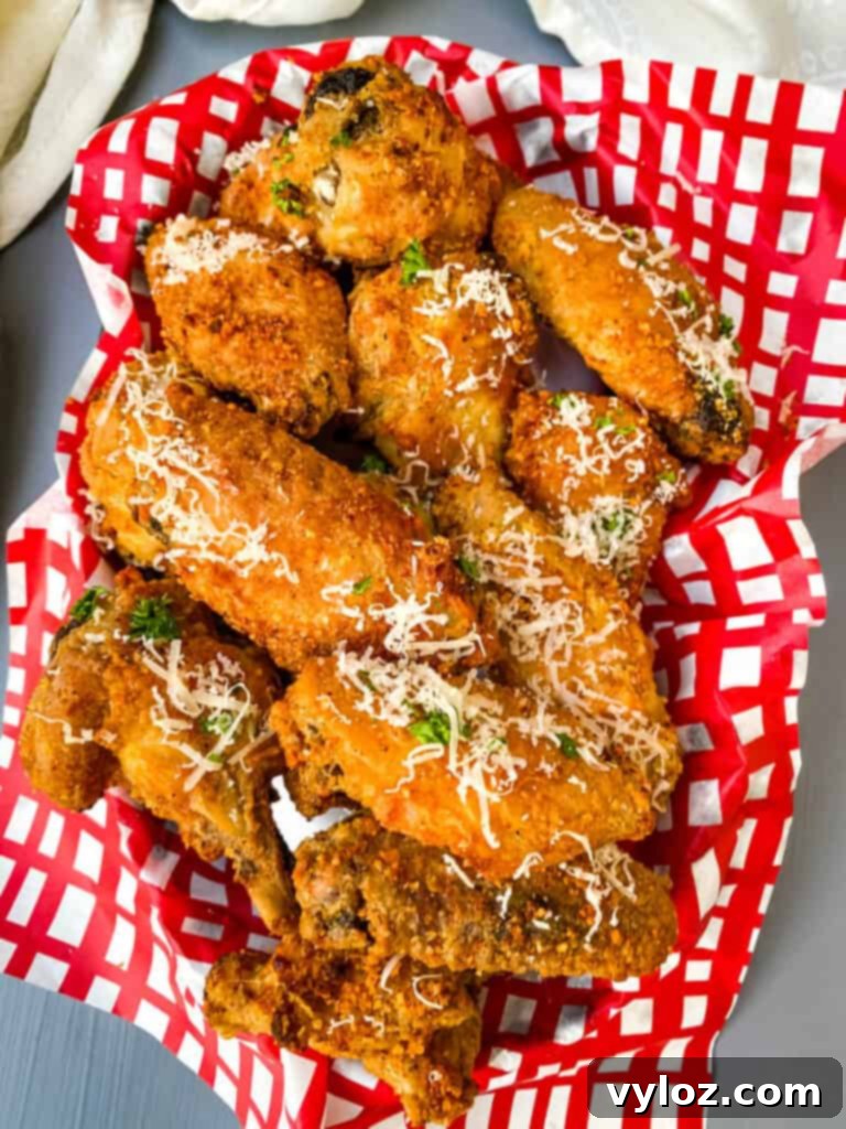 Garlic Parmesan Wings in a Bowl with Red and White Napkin