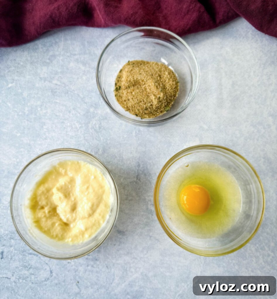 egg, breadcrumbs, and mayo in separate glass bowls