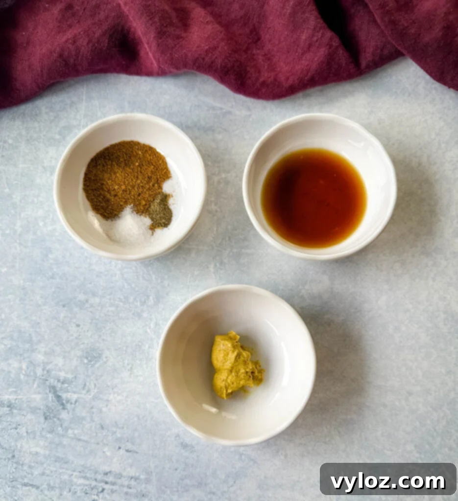 Old Bay seasoning, hot sauce, and mustard in separate white bowls