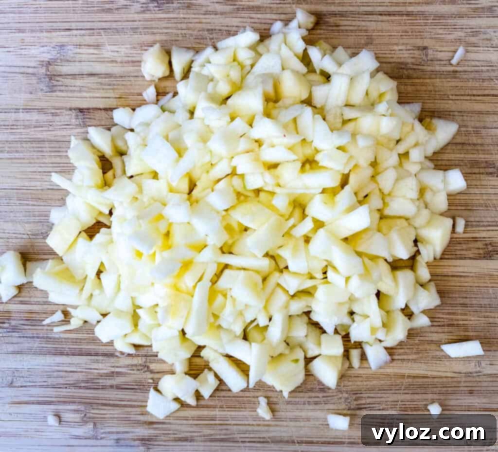 Golden Air Fryer Dessert Empanadas 6 chopped apples on a cutting board