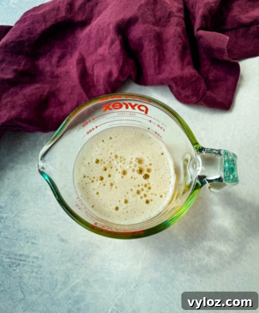 Creamy Beer Cheese Soup with Smoked Bacon 4 beer in a glass measuring cup