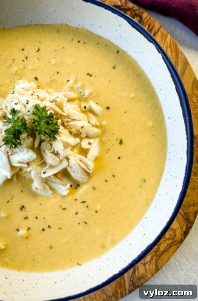 crab bisque in a white bowl with lump crab meat and flour
