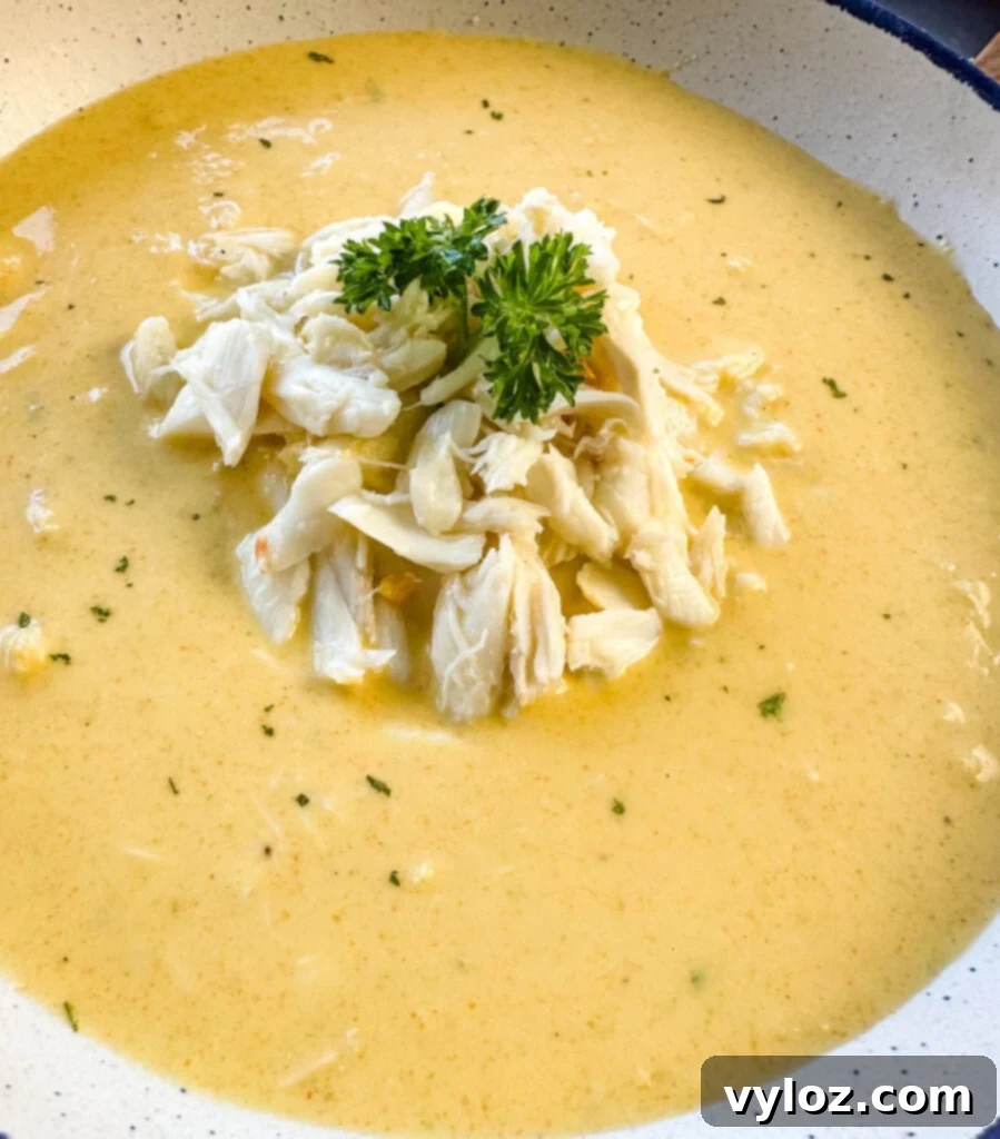 crab bisque in a white bowl with lump crab meat and flour