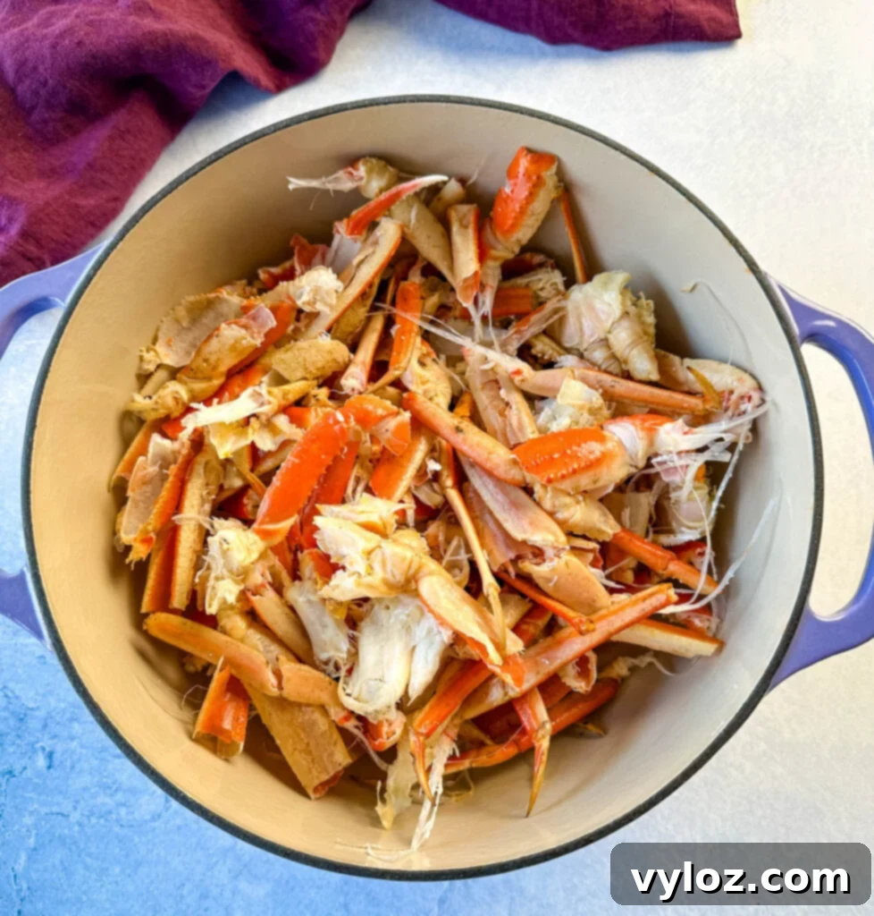 Oceanic Flavor Base 6 A large quantity of crab shells filling a Dutch oven, ready for simmering into a rich seafood stock.