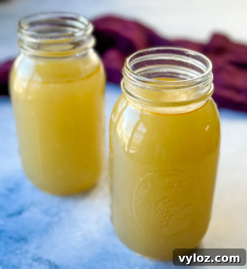 Oceanic Flavor Base 9 Homemade seafood stock stored in clear glass mason jars, ready for refrigeration or freezing.