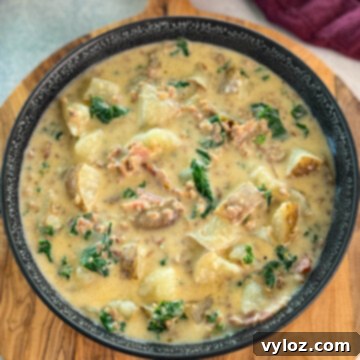 Hearty Italian Sausage and Kale Soup 11 Italian sausage soup with potatoes and kale in a black bowl