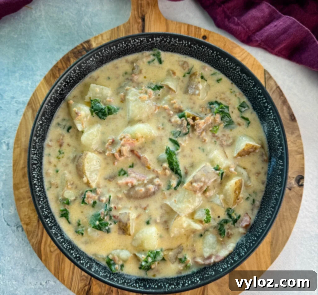 Hearty Italian Sausage and Kale Soup 10 Italian sausage soup with potatoes and kale in a black bowl