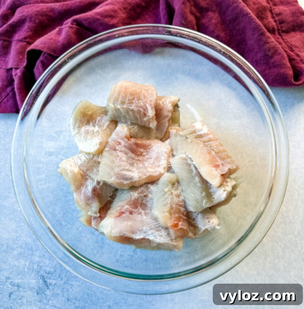 Simple Catfish Nuggets 5 raw catfish nuggets in a glass bowl