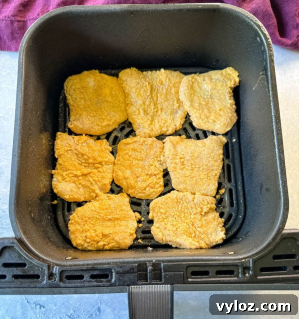 Simple Catfish Nuggets 9 uncooked catfish nuggets in an air fryer
