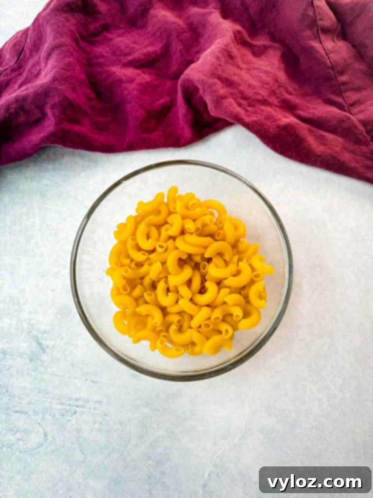 Savory Bacon Cheeseburger Mac Soup 4 elbow macaroni pasta in a glass bowl