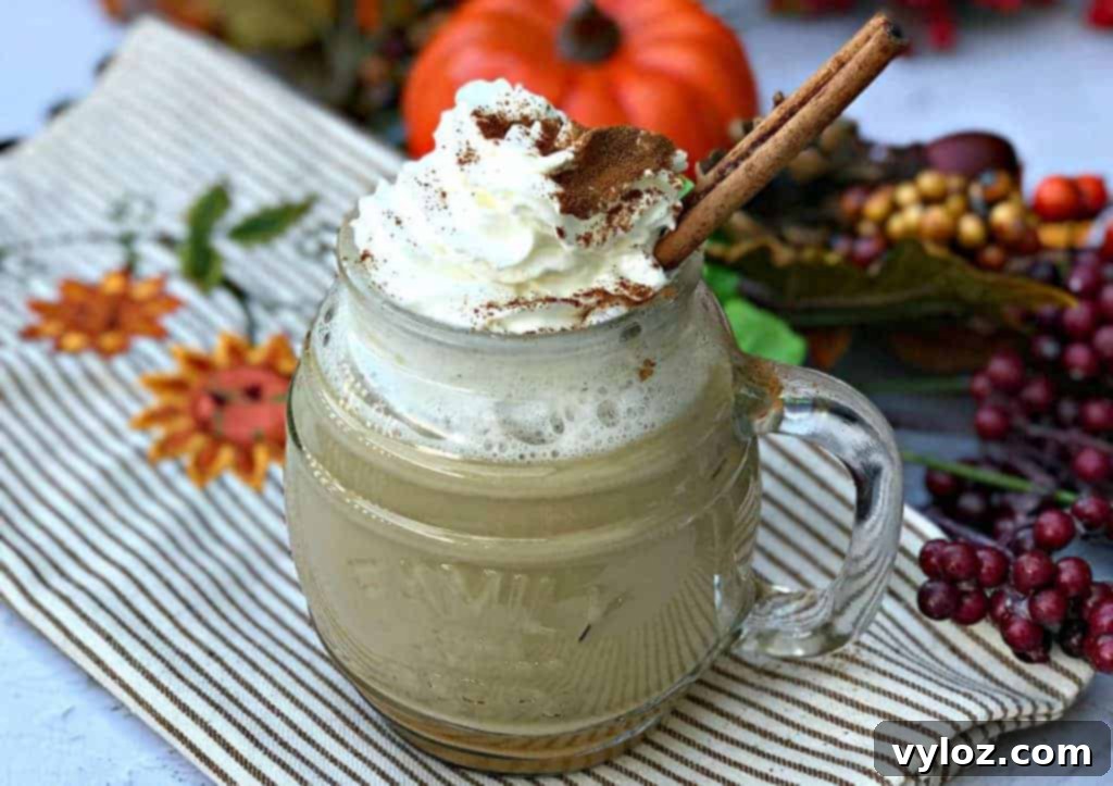 Instant Pot Skinny Pumpkin Spice Latte in a glass mug with cinnamon sticks